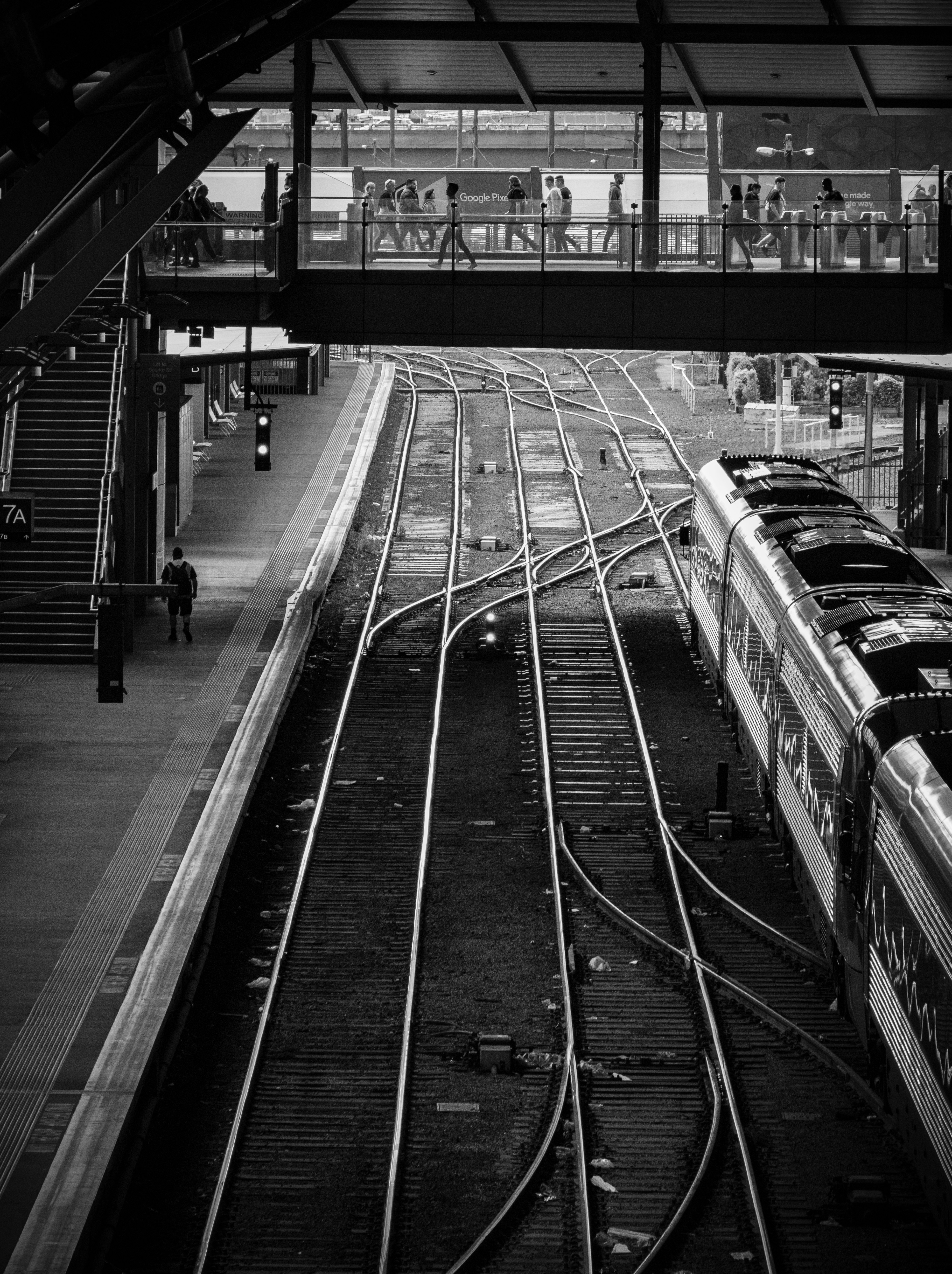 grayscale photo of train rail